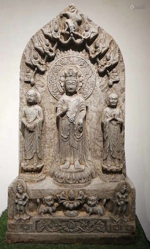 A STONE ORNAMENT CARVED WITH BUDDHA