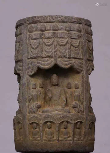 A STONE ORNAMENT CARVED WITH BUDDHA