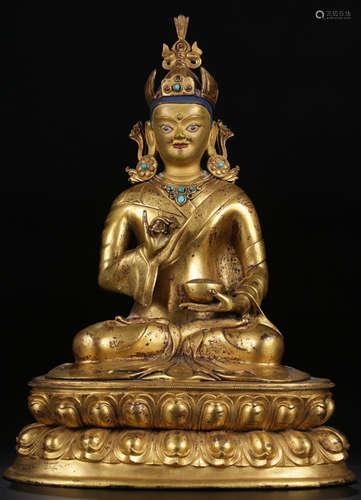 A GILT BRONZE BUDDHA STATUE EMBEDDED WITH GEM