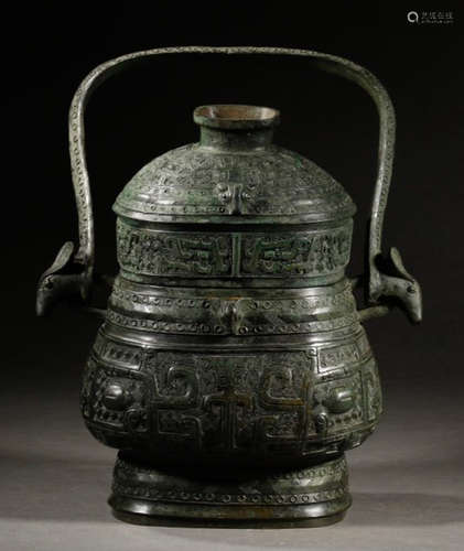 A COPPER CONTAINER CARVED WITH BEAST PATTERN