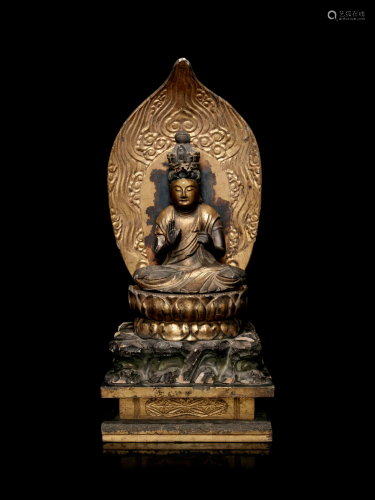 A Gilt Lacquered Wood Figure of Seated Kannan