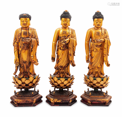 Three Gilt Lacquered Wood Figures of Buddha