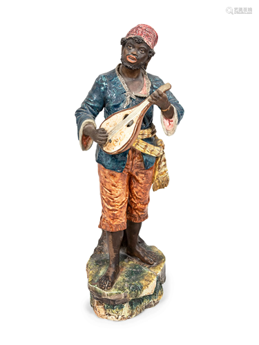 A Glazed Ceramic Figure of a Musician Height 2…