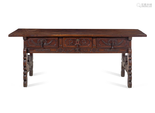 A Continental Carved Walnut Trestle Table