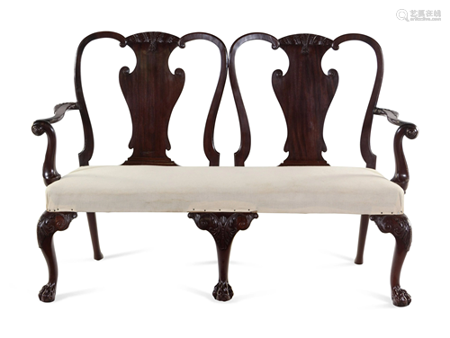 A George III Carved and Figured Mahogany Double-Chair