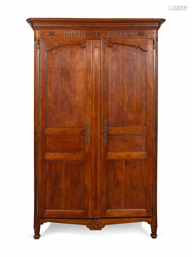 A French Provincial Carved Walnut Armoire