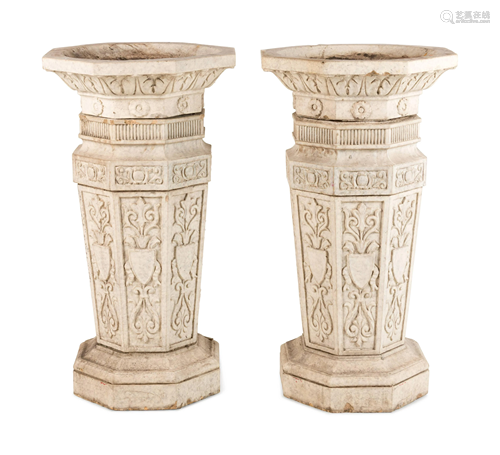 A Pair of Glazed Terra Cotta Urns and Pedestals