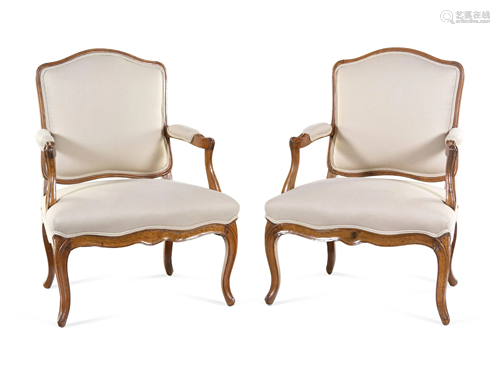 A Pair of Louis XV Carved Beechwood Fauteuils