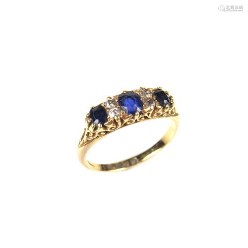 18 ct yellow gold sapphire and diamond three stone ring.