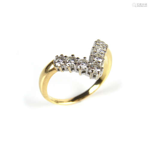 Yellow gold diamond wishbone ring.