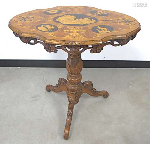 A 19th Century walnut Black Forest tilt top tripod table, marquetry top inlaid with Goats, Deer