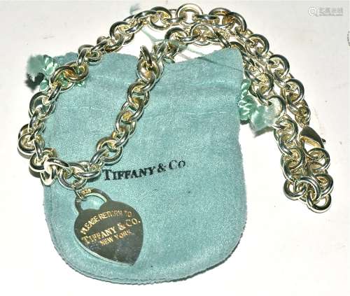 A Tiffany and Co 925 silver chain link necklace, the heart pendant marked 'Please return to