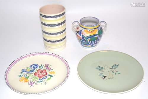 Four pieces of Poole pottery, including a mid Century freeform Poole cylindrical vase with free form