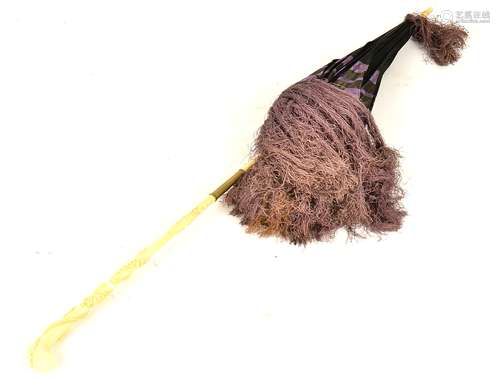 A Victorian ivory handled parasol, with encircling plant life decoration and tasselled purple and