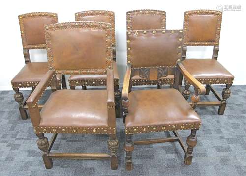 A set of four 1920s Oak dining chairs, upholstered in a brown Rexine fabric with metal studding,