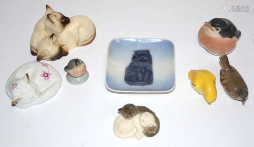 A small collection of china cats and birds, to include a pair of Royal Doulton Siamese cats,