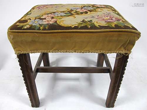 An antique mahogany stool, with square chamfered moulded legs, united by an H stretcher, floral