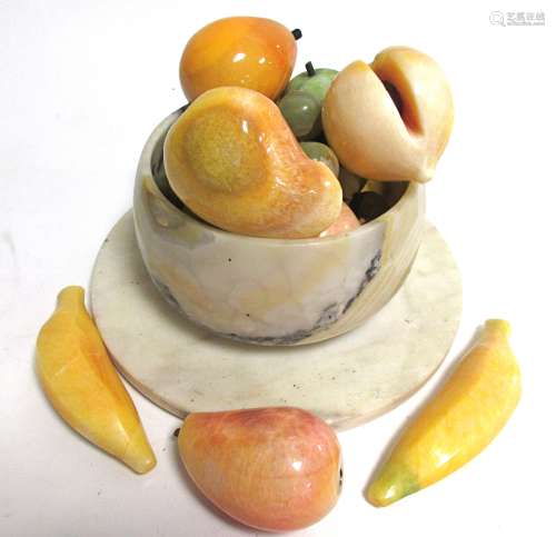 An onyx hardstone bowl with carved fruits, to include bananas, apples, grapes and pears, and