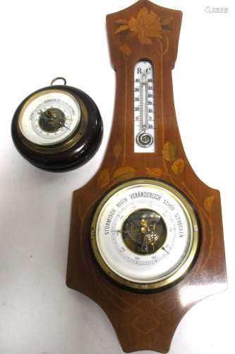 An Art Nouveau satinwood banjo shaped barometer, with inlaid decoration of roses, length 53cm,