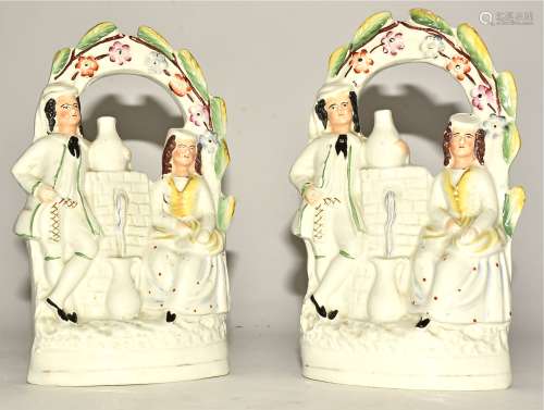 A pair of Victorian Staffordshire figures with meeting at the fountain, height 19cm (2)