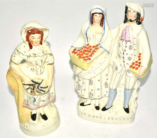 Two Victorian Staffordshire figures of market sellers, one marked 'Orange Sellers', height 36.5cm (