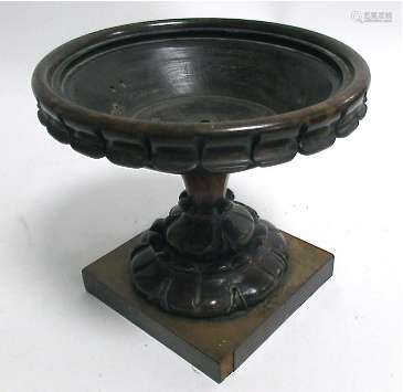 A 19th Century treen rosewood circular centre bowl, with decorative carving, 20cm x 22cm,