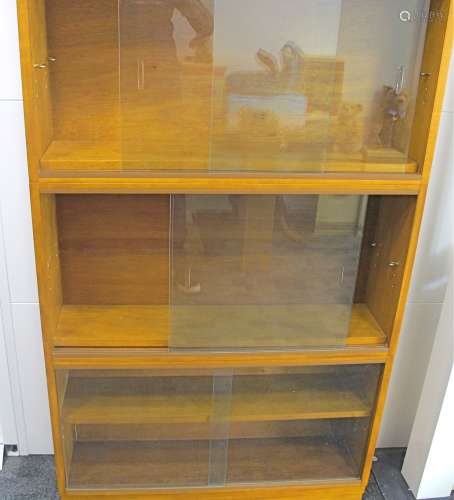 A mid-Century Simplex light oak five tier sectional bookcase, four larger section having one a