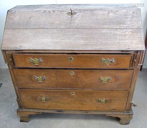 A Georgian oak farmhouse bureau, fitted interior, raised on bracket feet, 111cm x 54cm x 111cm