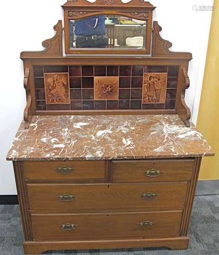 An Edwardian walnut tiled backed wash stand, two short over two long drawers to base, panelled