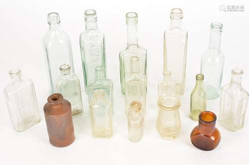 A small quantity of collectable glass bottles to include 'Veno's Lightning Couch Cure', height 14cm,