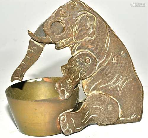 An early 20th Century novelty cigar cutter taking the form of an elephant, with trunk reaching