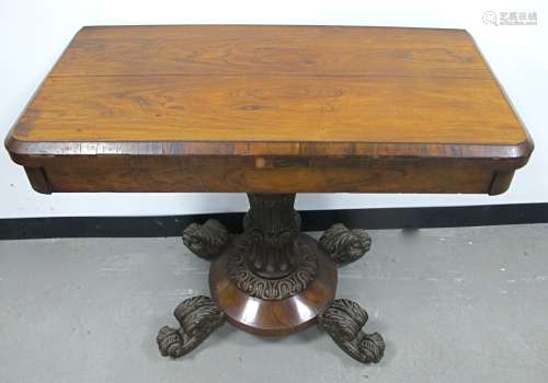 A William IV rosewood card table swivel action fold over top fitted to the inside with a circular
