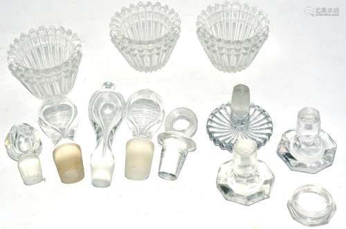 A small quantity of glass stoppers for decanters, of various forms and three moulded glass bowls (