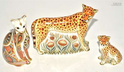 Three Royal Crown Derby paperweights, the largest the 'Cheetah Daddy' c2009, height 13cm, together