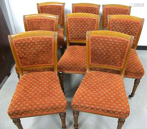 A set of eight 19th Century oak dining chairs, in the style of Gillows, with padded backs and