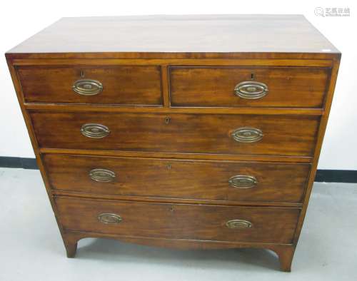 A Regency mahogany veneered chest, two short over three long graduated drawers, swept apron,