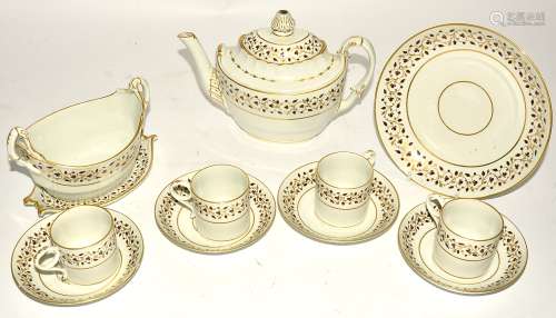 An 18th Century part porcelain tea service, the teapot of rococo boat shape, on a cream ground