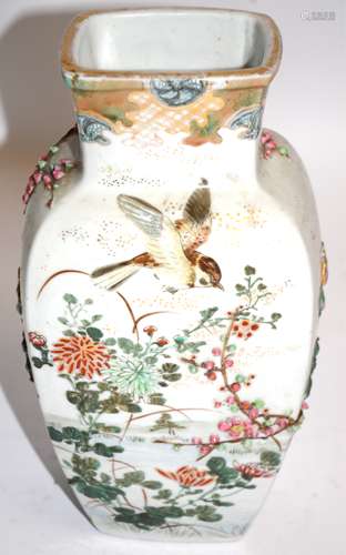 A large Japanese vase of baluster form with raised decoration of birds and plant life, height 31cm