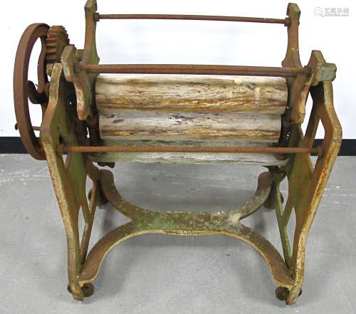 A vintage cast iron Stowaway washing mangle, in need of restoration