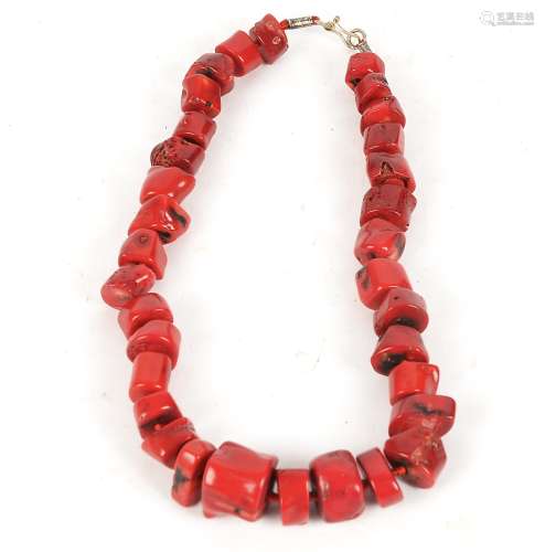 A coral necklace, with irregular polished coral cubes, length 24cm