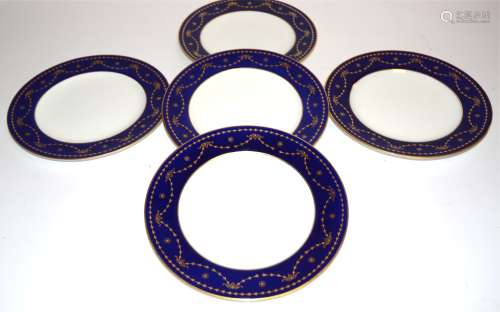 Five Spode Copelands china plates originally retailed at Harrods, with gilt swag decoration on a