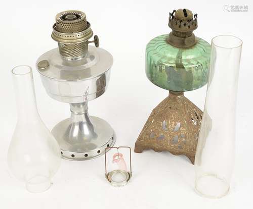 Two British 20th Century oil lamps, one on a cast metal pyramid base with green glass, height