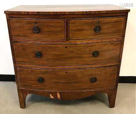 A late Victorian bow front mahogany veneered chest of drawers, two over three with shaped apron,