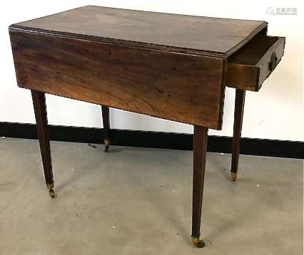 A Georgian mahogany Pembroke table, on four tapered supports with castors, cracked, top measures