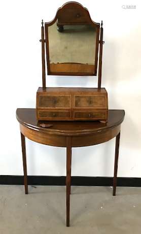 A Victorian walnut veneered toilet mirror, shaped mirror on two supports over base with four