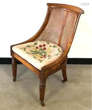 A Victorian rosewood slipper / sabre chair, fluted front supports, sabre back legs, rattan seat