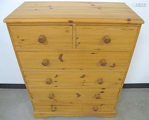 A contemporary Pine chest, of two short over three long drawers, moulded top, raised on a shaped