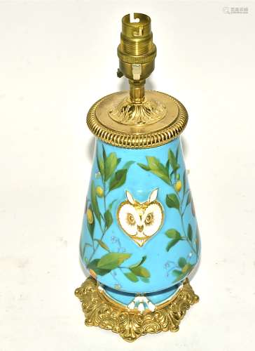 A 19th Century porcelain lamp base in the manner of Minton, on a bleu celeste ground with opposing