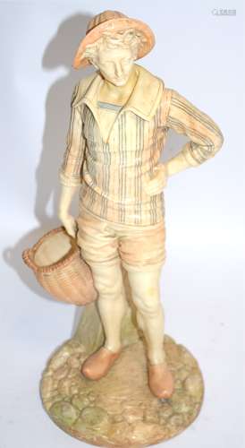James Hadley for Royal Worcester, a youthful young male figure with a basket, possibly a European