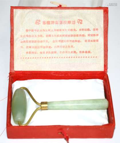 A 20th Century boxed Jade roller, length 12cm